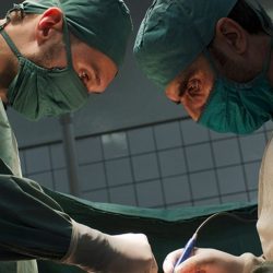 EMERGENCY surgeons operating on a war victim in Afghanistan